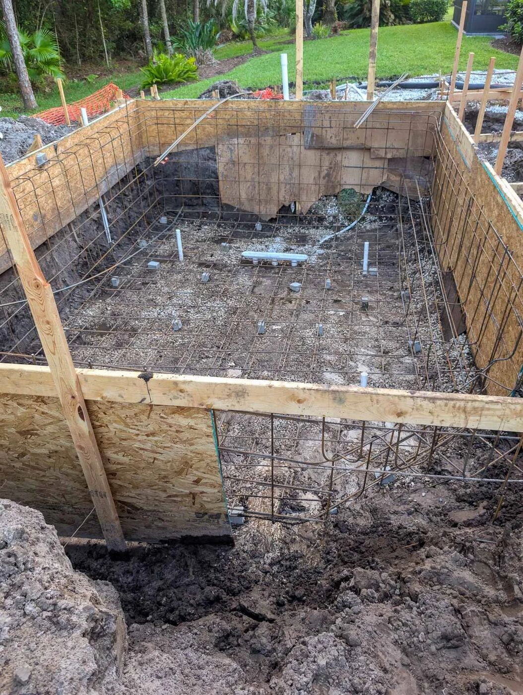 Pool rebar and formwork on an active construction site